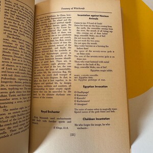 May include: Open book with pages displaying text about witchcraft, incantations, and religious symbols. The text includes phrases like "Incantation against Noxious Animals" and "Egyptian Invocation."