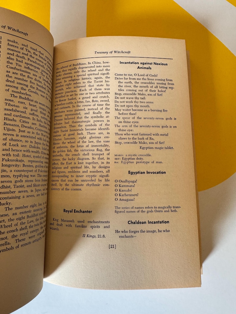 May include: Open book with pages displaying text about witchcraft, incantations, and religious symbols. The text includes phrases like "Incantation against Noxious Animals" and "Egyptian Invocation."