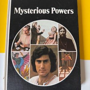 May include: Vintage book titled "Mysterious Powers" with a black cover and white text. The cover features a circular collage of images, including portraits and illustrations. The book is set against a yellow and white background.