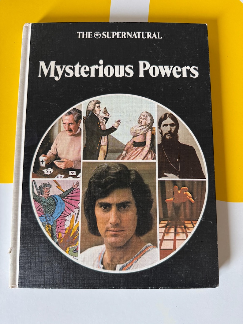 May include: Vintage book titled "Mysterious Powers" with a black cover and white text. The cover features a circular collage of images, including portraits and illustrations. The book is set against a yellow and white background.