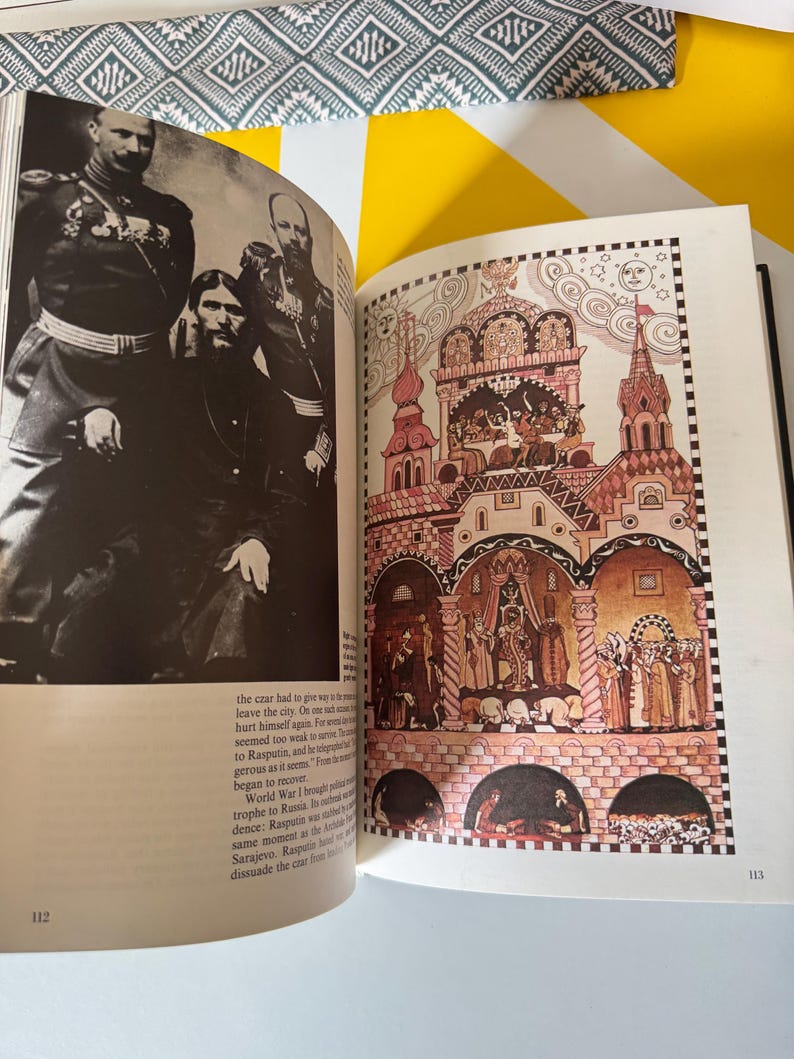 May include: Open book with two facing pages. One page features a black and white photograph of several men in military uniforms. The other page displays a colorful illustration of a building with multiple towers and arches, with figures inside.