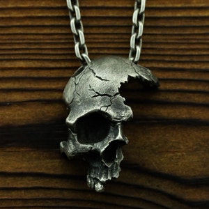 Broken skull necklace deals