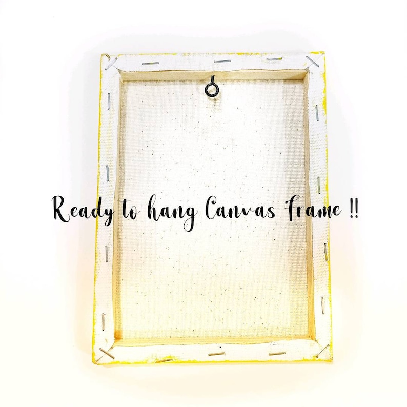 May include: A white canvas frame with a yellow border and a metal hanging ring on the back. The text "Ready to hang Canvas frame!!" is printed on the back of the frame.
