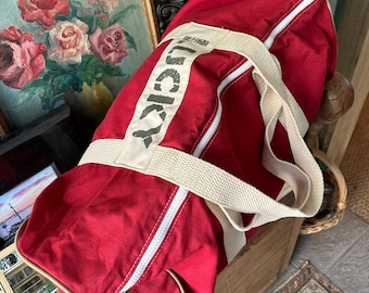 Duffle Bags Lucky red round duffle & Billabong duffle bag Hawaiian  print. A collection of weekenders both sold together On Sale today.