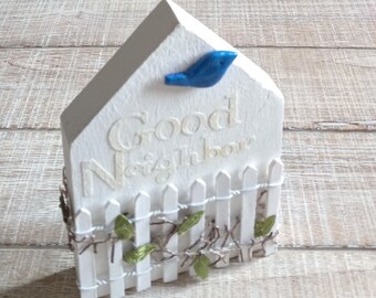 Premio al Buen Vecino: Regalo del Pájaro Azul de la Felicidad, Desarrollo Comunitario