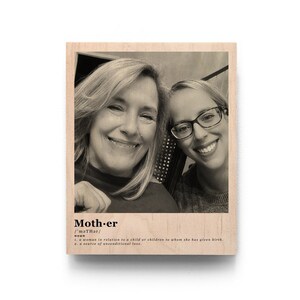 May include: A black and white photo of two women smiling. The photo is printed on a wooden plaque with the word "Mother" and its definition.