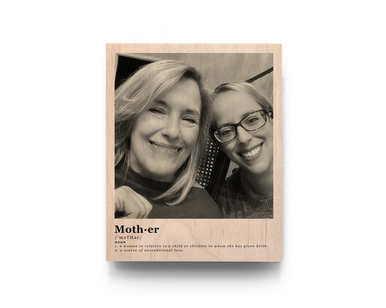 May include: A black and white photo of two women smiling. The photo is printed on a wooden plaque with the word "Mother" and its definition.