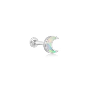 May include: A silver-colored, crescent moon-shaped earring with an iridescent opal inlay. The earring has a flat back and a post for piercing. The opal displays a range of colors, including white, green, and blue.
