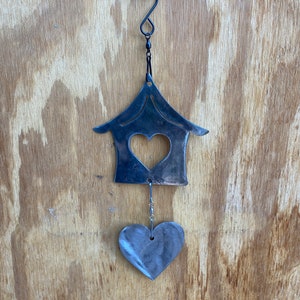 Whimsical House  Wind Spinner with hanging heart, type of wind chime but doesn’t chime, outdoor and indoor hanging decoration that spins.