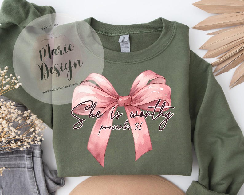 May include: A green sweatshirt with a pink bow and the text "She is worthy Proverbs 31" printed on the front.