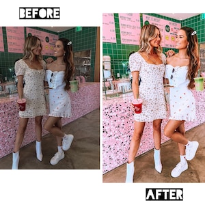 May include: Two people wearing white floral dresses and white sneakers stand in front of a pink and green tiled wall. They are holding red and green drinks.