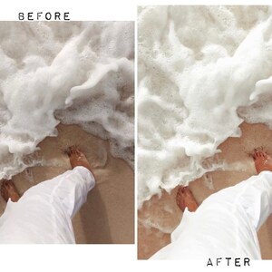 May include: A person's feet are in the sand with white foamy waves crashing around them. The person is wearing white pants.