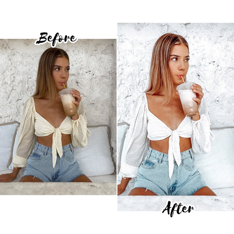 May include: A woman wearing a white crop top with a tie detail and denim shorts is drinking from a cup with a straw. The background is a white brick wall.