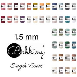 May include: A collection of spools of 1.5 mm single twist Bobbiny cord in various colors. The spools are arranged in rows, showcasing a wide range of hues, from pinks and purples to greens and blues. The Bobbiny logo and text are also visible.