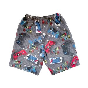 May include: Gray fleece shorts with a pattern of video game controllers, joysticks, and the phrases "Game Over", "Level Up", and "Eat Sleep Repeat".
