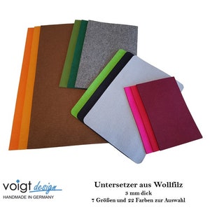 Könnte beinhalten: Sortiment an Filzuntersetzern in verschiedenen Farben und Größen, darunter Orange, Braun, Grün, Grau, Schwarz, Limettengrün, Pink und Burgunderrot. Die Untersetzer sind 3 mm dick und aus Wollfilz gefertigt. Der Text "Untersetzer aus Wollfilz 3 mm dick 7 Größen und 22 Farben zur Auswahl" ist im Bild sichtbar.