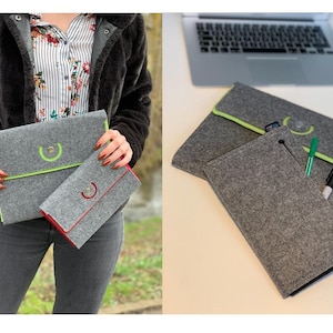 Könnte beinhalten: Zwei graue Filz-Laptoptaschen mit kontrastierenden Farbkanten. Die größere Tasche hat einen lindgrünen Saum und die kleinere Tasche einen roten Saum. Beide Taschen haben einen runden Metallakzent.
