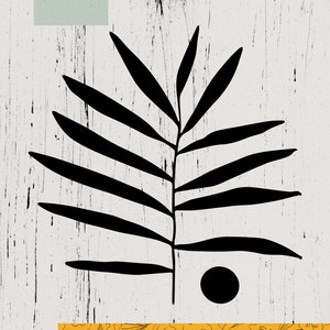 May include: Abstract art print featuring a black silhouette of a palm leaf with a black circle on a white background. The bottom of the print features a yellow background with a black floral pattern.