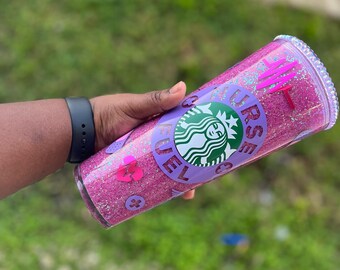 May include: A pink and purple glitter tumbler with a Starbucks logo and the text "Nurse Fuel".