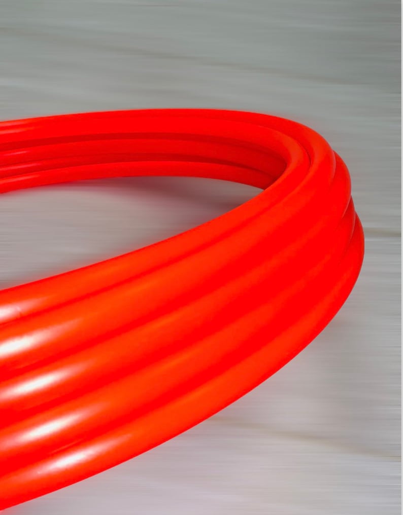May include: A bright orange, flexible, corrugated pipe.