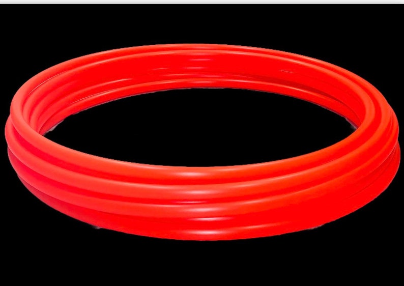 May include: A bright red inflatable pool ring, made of thick, durable plastic. The ring is designed for swimming and water play.