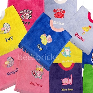 May include: Assortment of colorful hooded towels with embroidered designs and names, including a bee, a crab, a bird, a cat, and a fish. The towels are made of soft, absorbent material and are perfect for keeping little ones warm and dry after bath time.