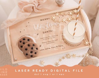 May include: A wooden tray with a "Merry Christmas Santa!" message, a plate of chocolate chip cookies, a glass of milk with a straw, and a string of gold snowflake ornaments. The tray is decorated with a white and gold snowflake design.
