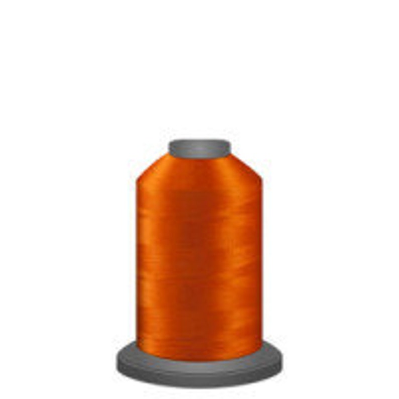 May include: A spool of bright orange thread.