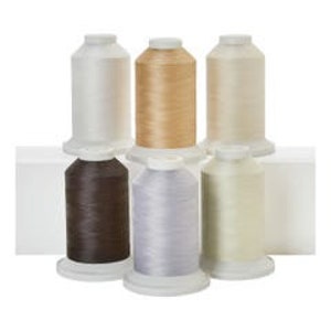 May include: Six spools of thread in various colors, including white, beige, brown, gray, and cream. The spools are arranged in two rows of three.