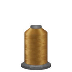 May include: A spool of gold thread for sewing or embroidery.