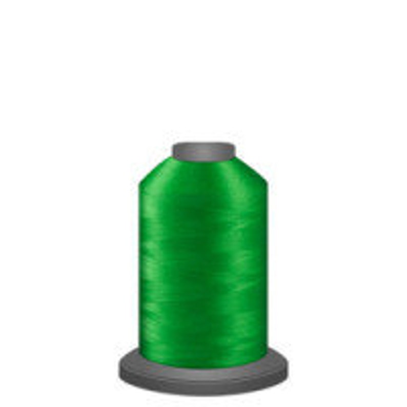 May include: A spool of bright green thread.