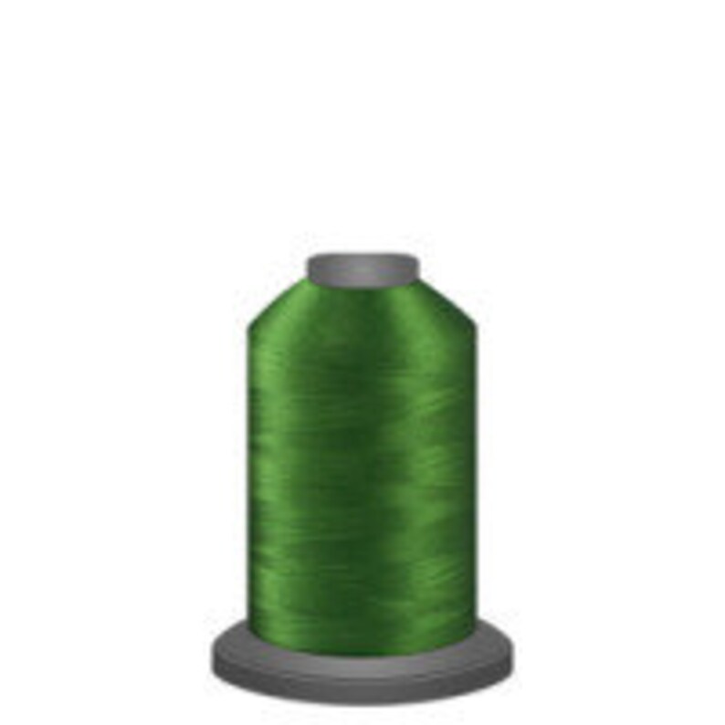 May include: A spool of bright green thread.