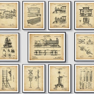 May include: A collection of framed vintage train patent prints. Each print features detailed black and white technical drawings of different train components and designs, set against a tan background. The prints are displayed in black frames.