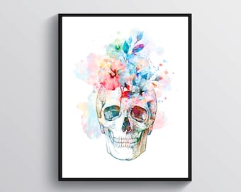 May include: A framed art print featuring a watercolor illustration of a human skull with colorful flowers and foliage bursting from the top. The artwork uses a vibrant palette of pink, blue, and yellow hues.