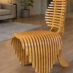 May include: A light brown wooden chair constructed from a series of vertical, parallel slats that form a continuous, curved shape from the backrest down to the seat and front legs, creating a layered, ribbed appearance throughout the structure.