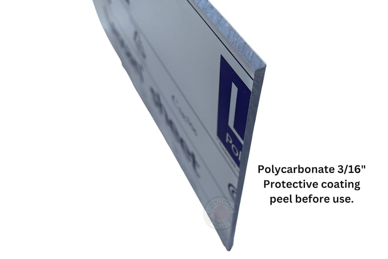 May include: Close-up of the edge of a white sign with blue text. The sign is made of 3/16" polycarbonate with a protective coating that needs to be peeled off before use.