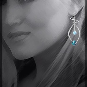 May include: Silver dangle earrings with a blue and light blue gemstone. The earrings feature a delicate, open design.