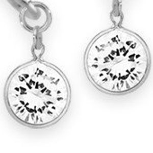 May include: A pair of silver dangle earrings with small round charms that have a textured design.