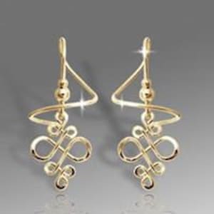 May include: Gold-toned dangle earrings with a spiral design and a small bead at the top.
