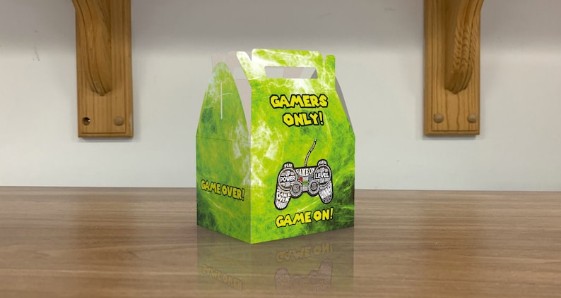 May include: Green and yellow favor box with a game controller graphic and the text "Gamers Only!" and "Game Over!" and "Game On!"