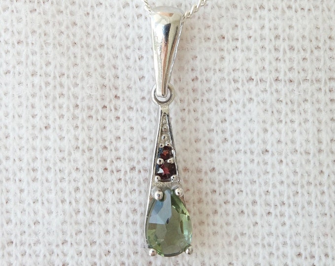 Silver 22K lux pendant Orion with faceted drop Czech green meteorite moldavite and garnets 925, 22 K, Ag+Rh certificate of authenticity