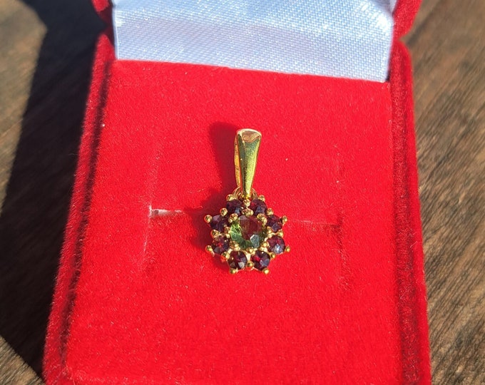Pendant poinsettia with natural round Czech moldavite and garnets 925 Sterling Silver 22 K, 585 White Gold 14 K, 585 Yellow Gold 14 K