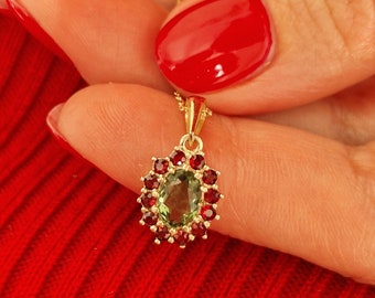 Camellia pendant with Czech moldavite and garnets white and yellow gold 925 Sterling Silver 22 K, 585 White Gold 14 K, 585 Yellow Gold 14 K