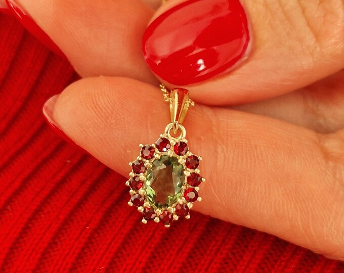 Camellia pendant with Czech moldavite and garnets white and yellow gold 925 Sterling Silver 22 K, 585 White Gold 14 K, 585 Yellow Gold 14 K