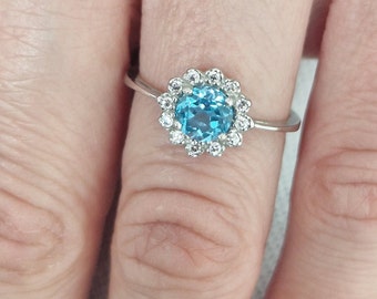 Silver topaz ring with natural round Swiss blue topaz and clear cubic zircons, certificate authenticity, all sizes in stock