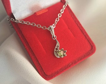 Silver pendant green flame with a round vltavin and garnets, elegant pendant with faceted Czech meteorite green moldavite crystal red garnet