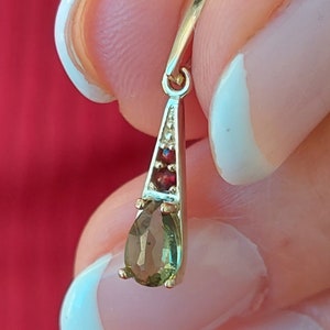 Pendant with faceted Czech moldavite and garnets white and yellow gold 925 Sterling Silver 22 K, 585 White Gold 14 K, 585 Yellow Gold 14 K