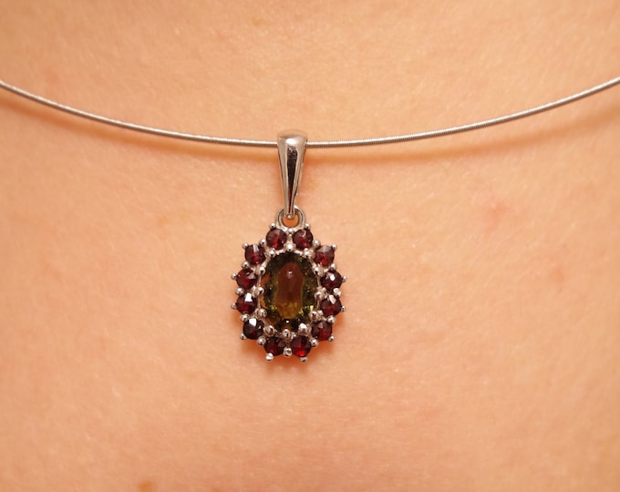 Silver pendant camellia with natural oval faceted Czech garnets pyrope and moldavite vltavin 925, 22 K, Ag+Rh certificate of authenticity