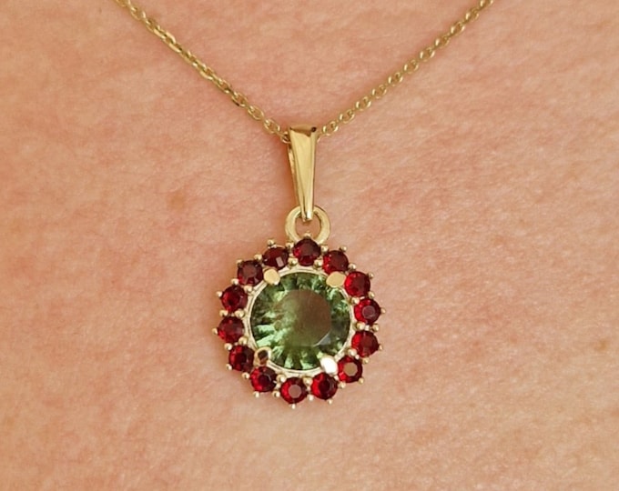 Pendant with faceted Czech moldavite and garnets white and yellow gold 925 Sterling Silver 22 K, 585 White Gold 14 K, 585 Yellow Gold 14 K