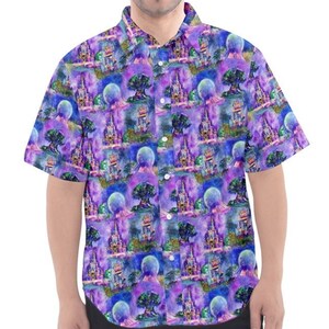 May include: A short-sleeved button-down shirt with a purple and blue watercolour print of a castle and a tree. The print is repeated all over the shirt.